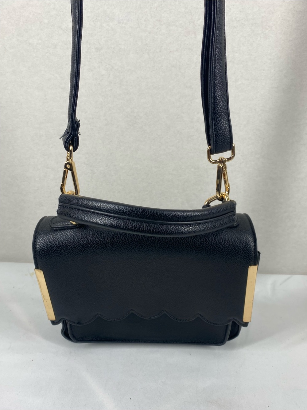 Elegant Black Crossbody Bag with Gold Hardware